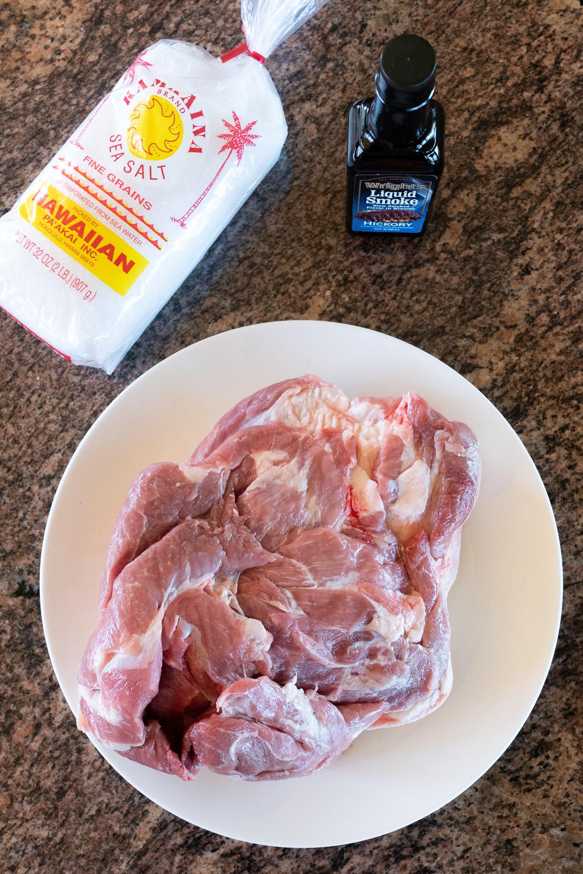 Three ingredients to make Kalua Pork: boneless pork butt, sea salt, and liquid smoke.
