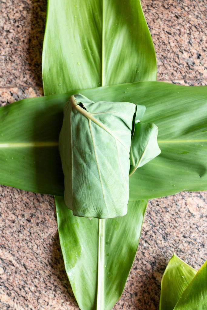 Luau leaf (from the kalo plant) in the middle. Ti leaf on the outside.