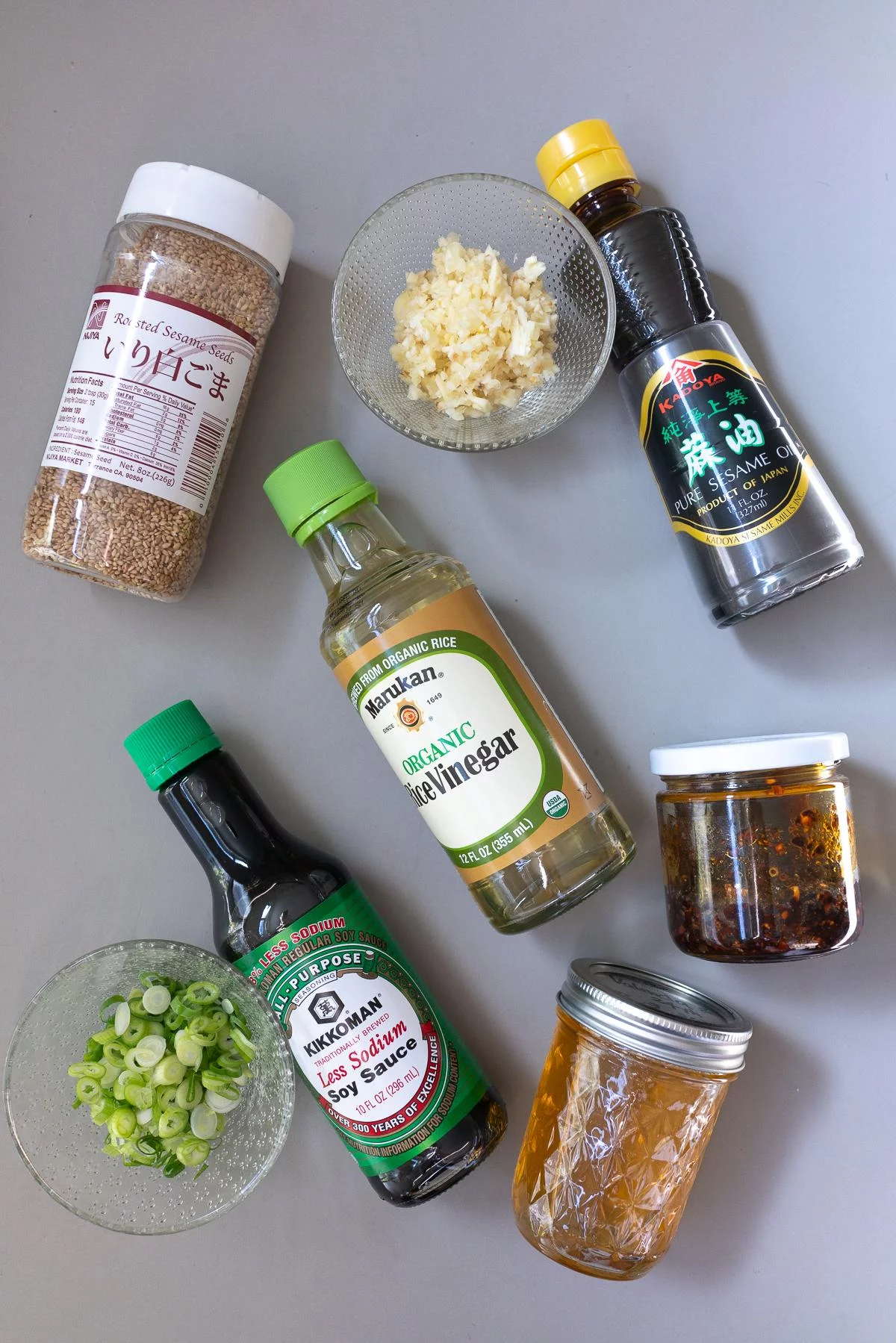 Ingredients for Dumpling Dipping Sauce (soy sauce, rice vinegar, sesame oil, chili oil, honey, sesame seeds, garlic, and green onions)
