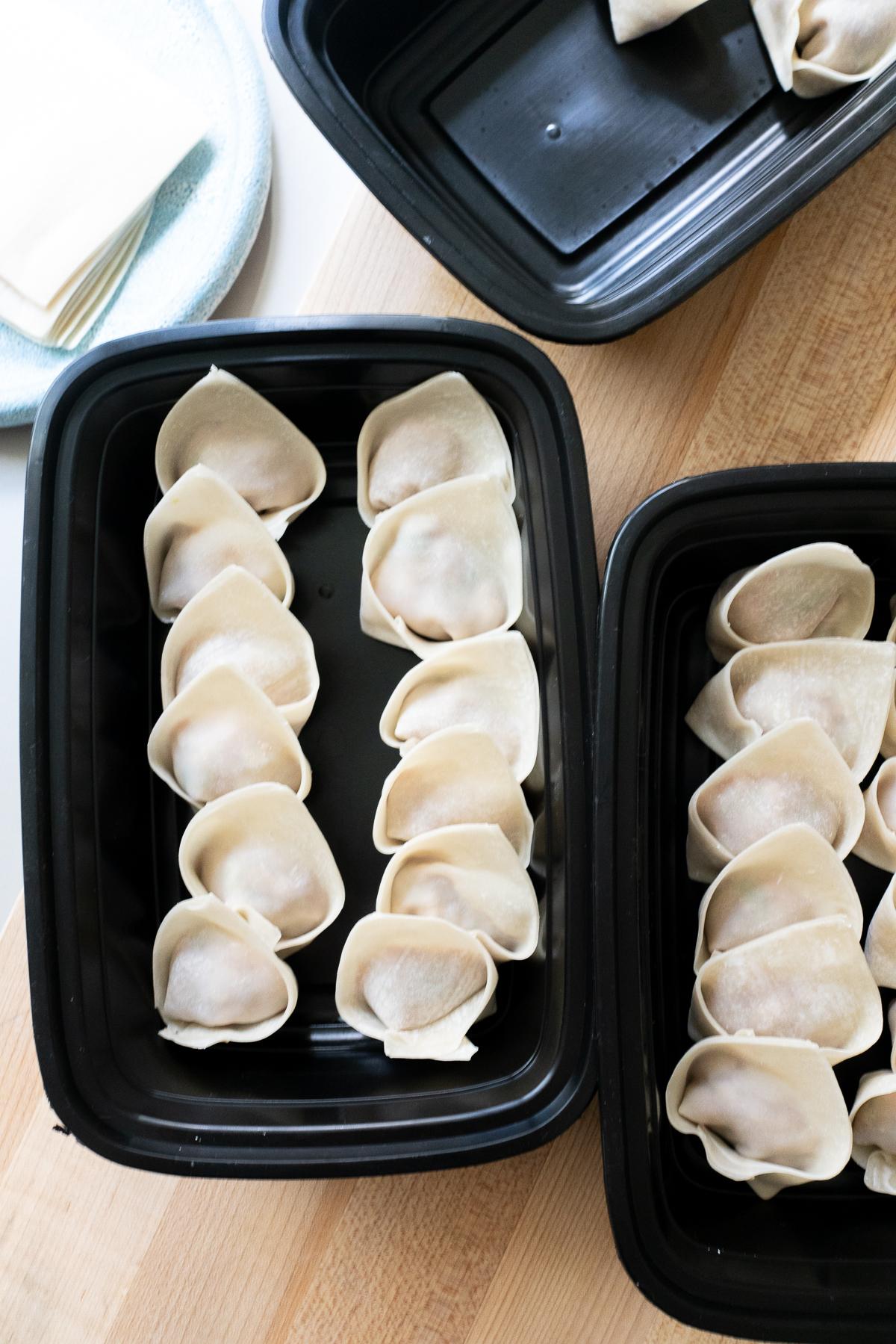 Wrapped wontons in containers