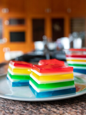 Cubes of Rainbow Jello on a plate