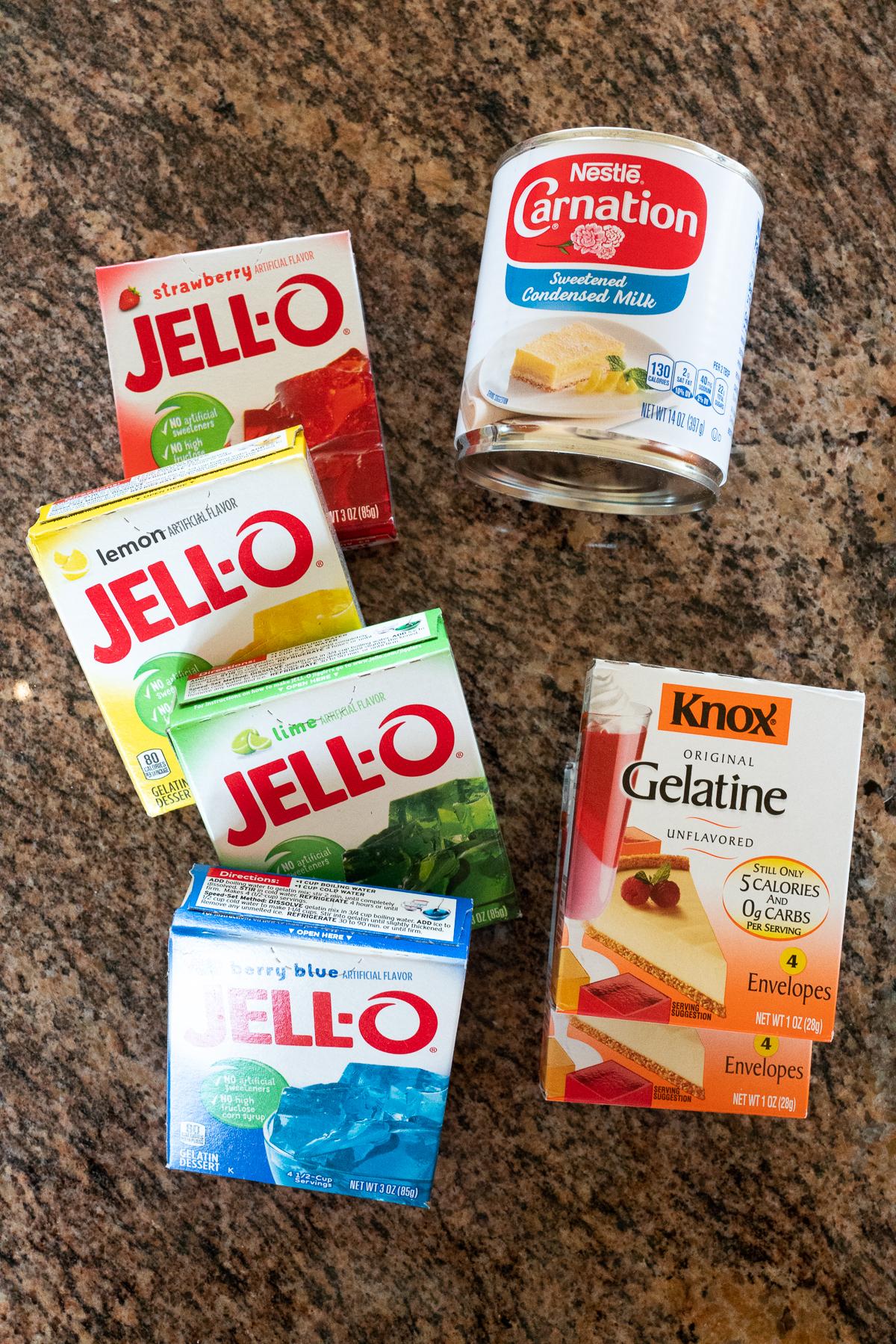 Ingredients to make Rainbow Jello (four Jello packs, Knox Gelatin, sweetened condensed milk)