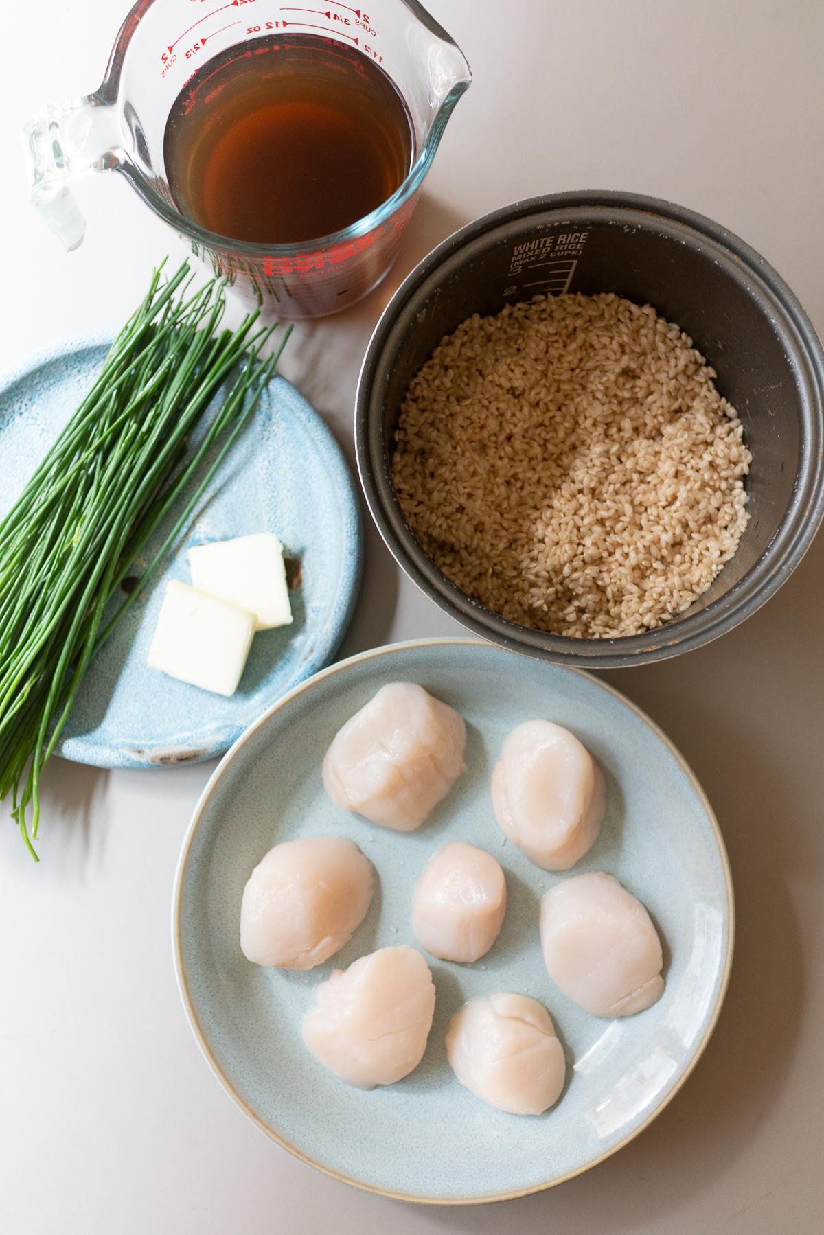 Ingredients for scallop and rice: scallops, rice, chives, butter, cooking broth