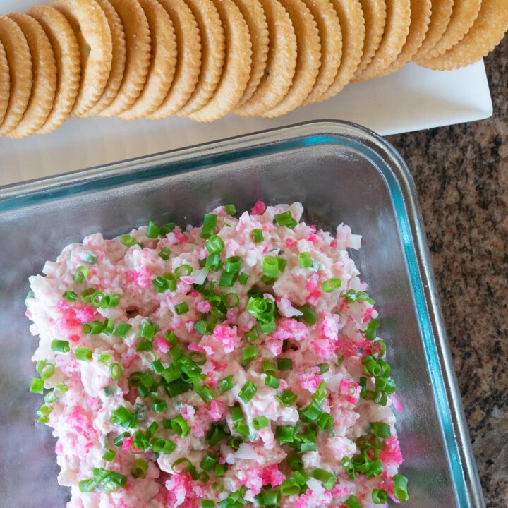 A serving dish of Kamaboko Dip and Ritz Crackers on the side.