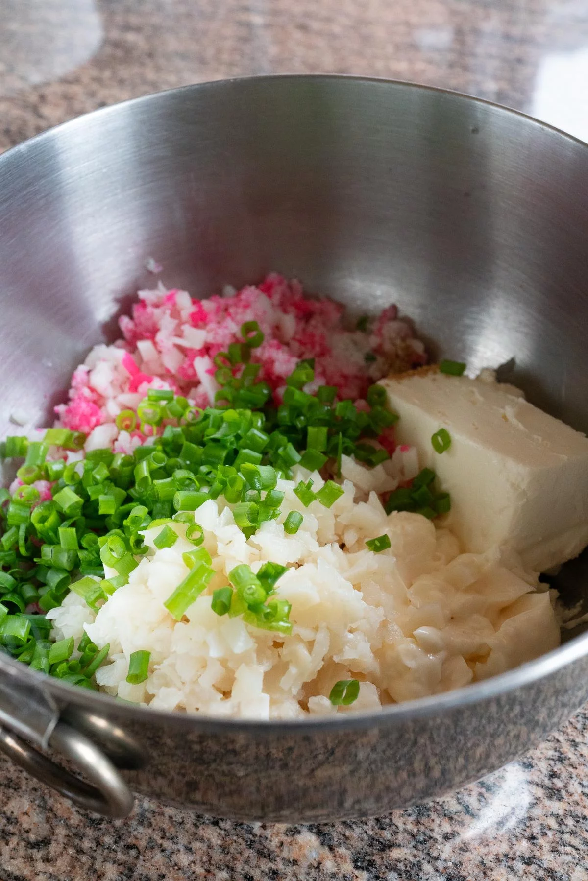 Ingredients for Kamaboko Dip: Kamaboko, mayonnaise, cream cheese, green onions, water chestnuts, Hondashi, and Ritz Crackers