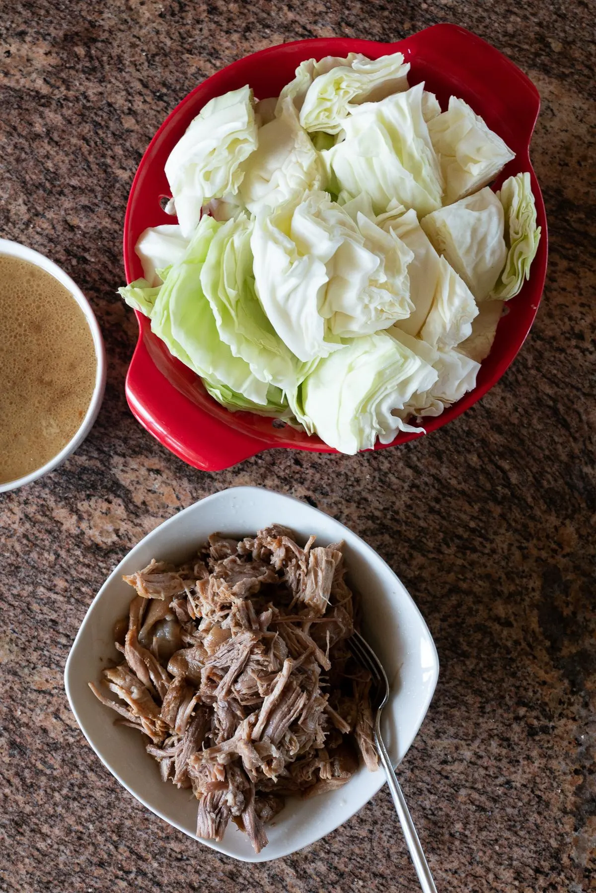 Ingredients for Kalua Pork and Cabbage: kalua pork, cabbage, and kalua pork drippings/juices (or chicken broth)
