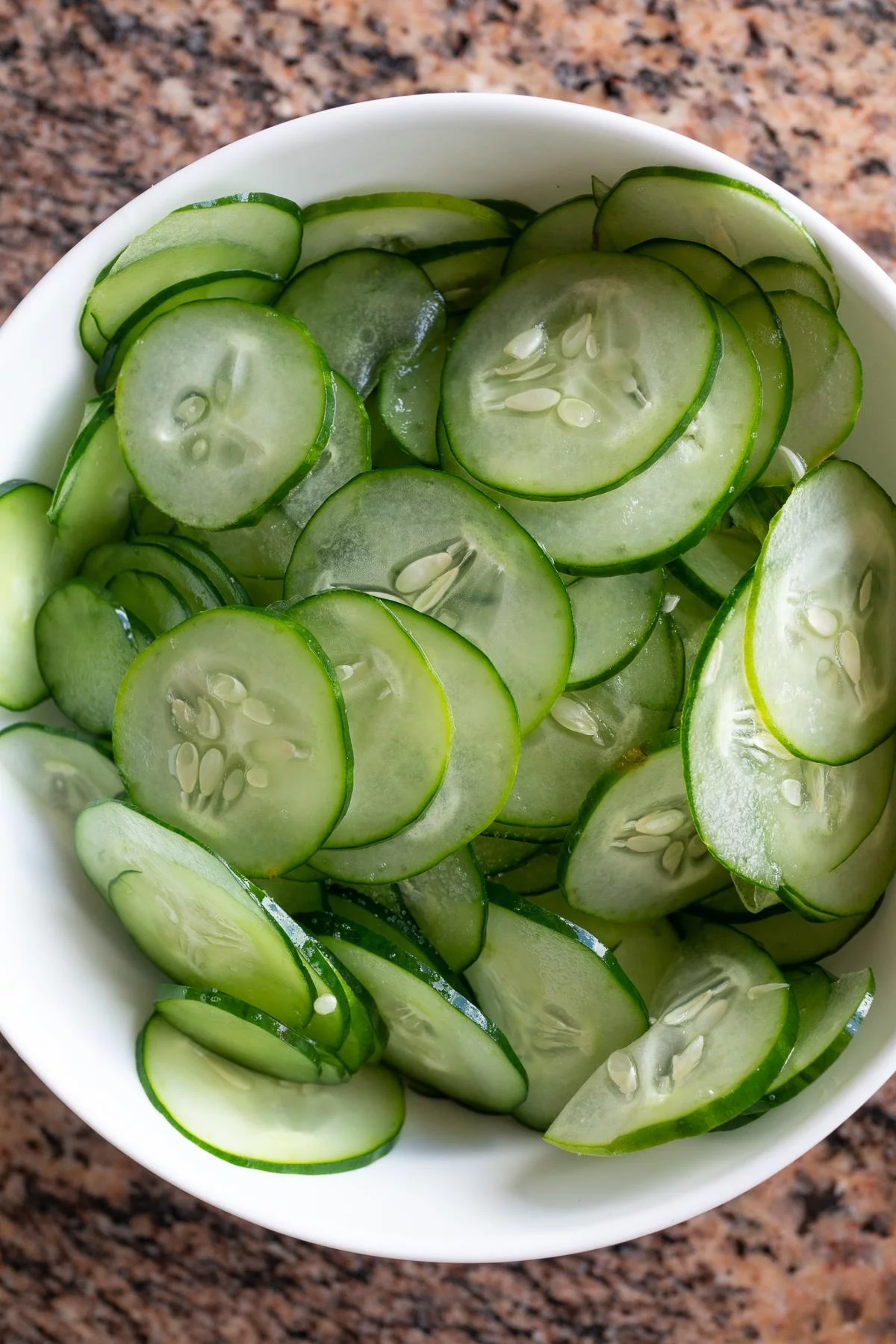 A bowl of thinly sliced Japanese cucumbers