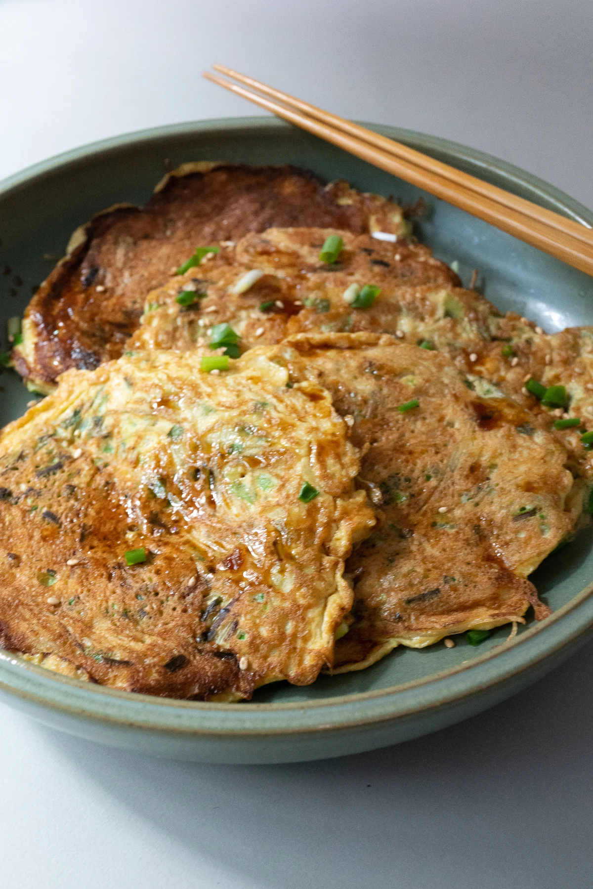 Prepared Chive Vermicelli Egg Pancakes served in a shallow dish.