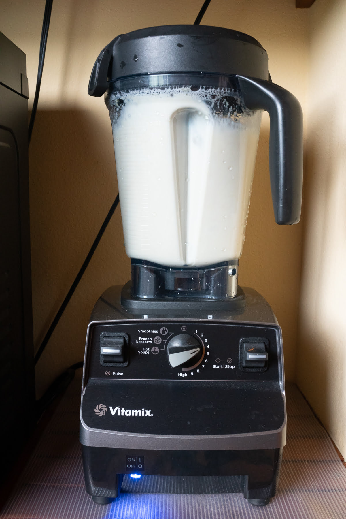 Blending soaked soybeans and water in the Vitamix.