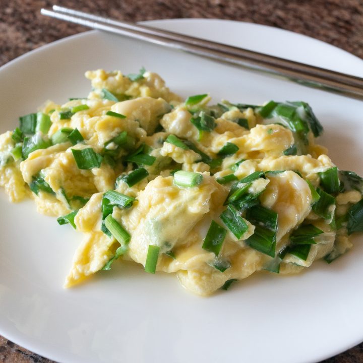 A plate of Chive and Egg Stir Fry, ready to eat.