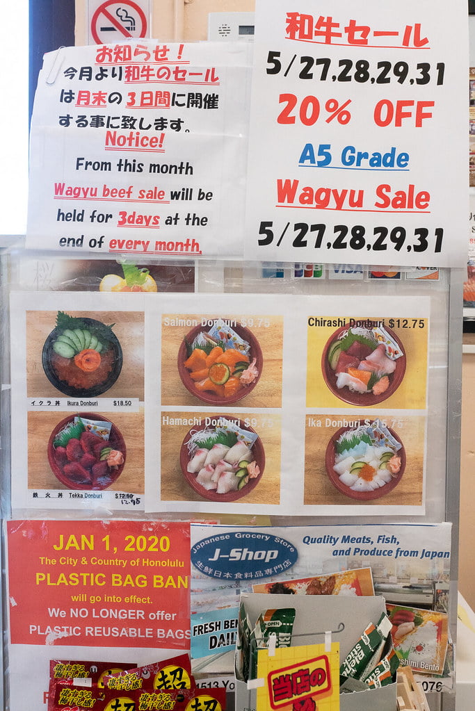 Picture menu and sale items at J-Shop in Honolulu.