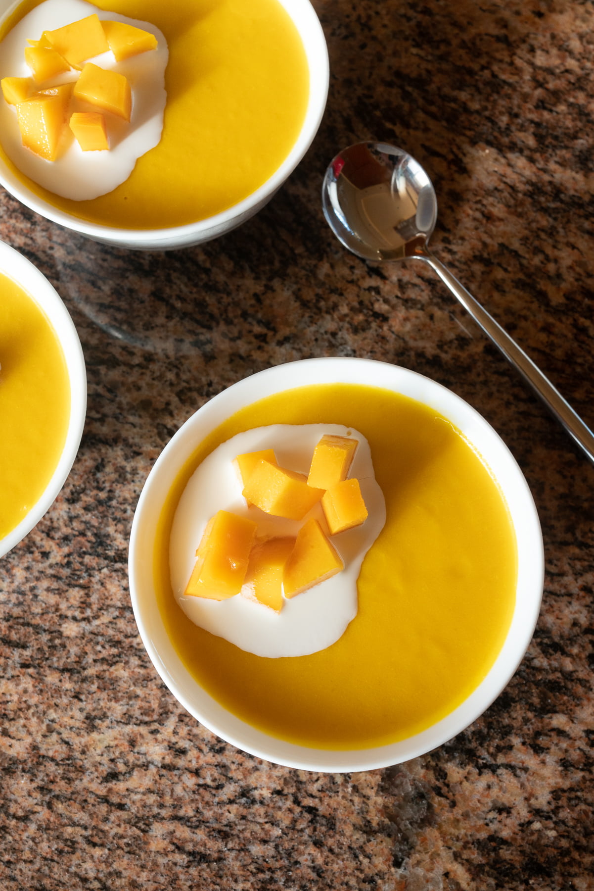 Bowls of mango pudding, ready to eat.