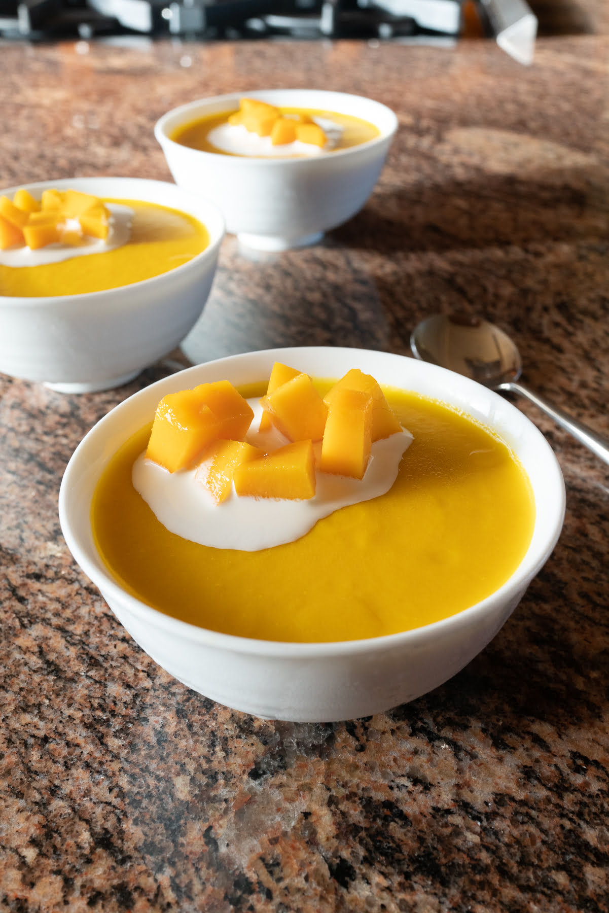 Bowls of mango pudding, ready to eat.