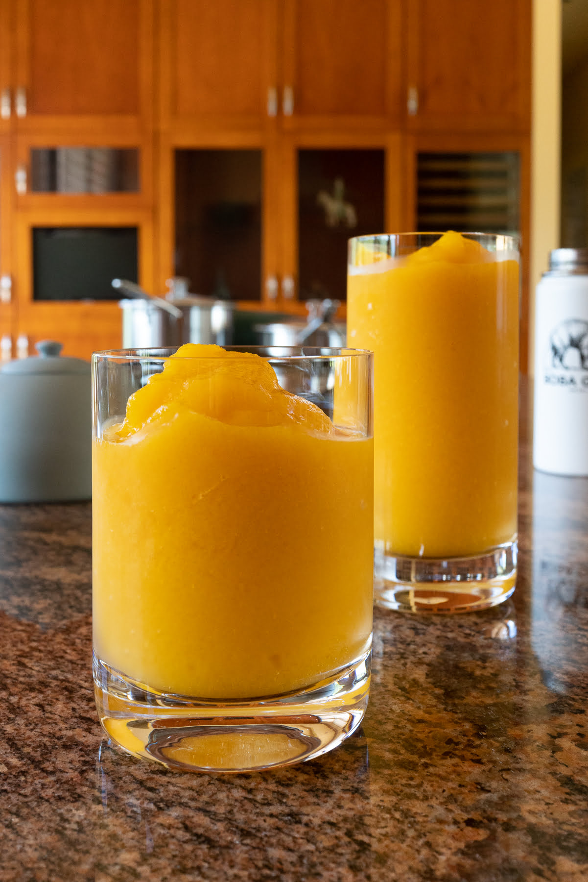 Two glasses of mango slush, ready to drink!