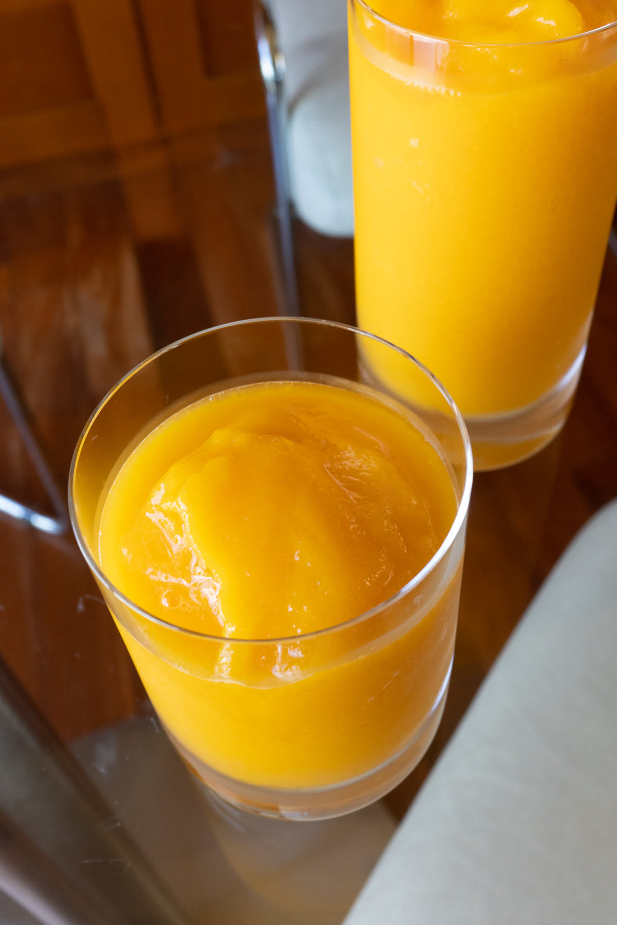 Two glasses of mango slush, ready to drink!