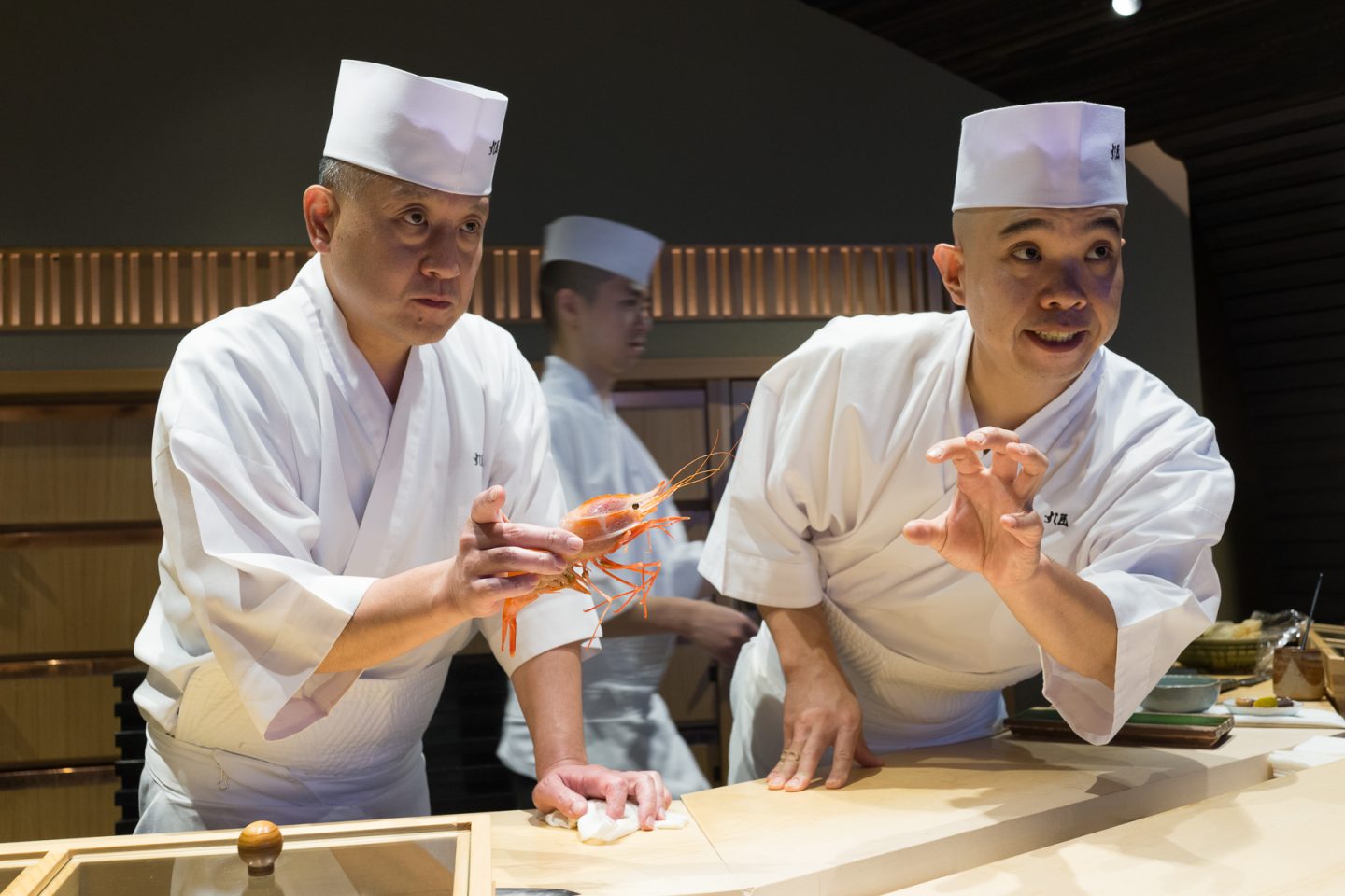 Chefs at the sushi bar of Sushi Sho.