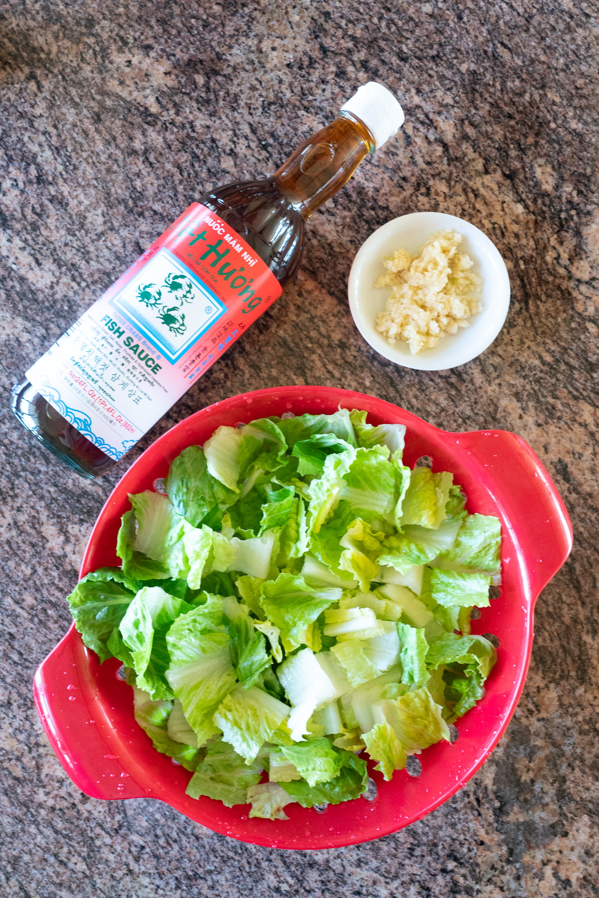 Ingredients for stir fried lettuce laid out on a countertop.