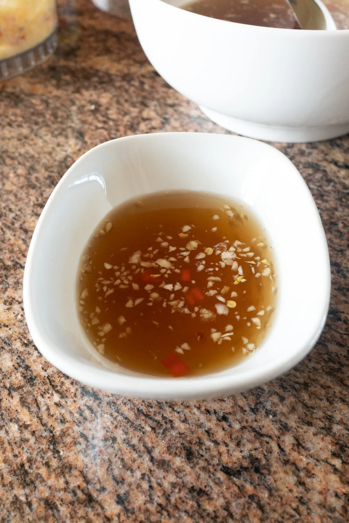 A bowl of Nuoc Cham / Nuoc Mam (Vietnamese Fish Sauce Dipping Sauce).