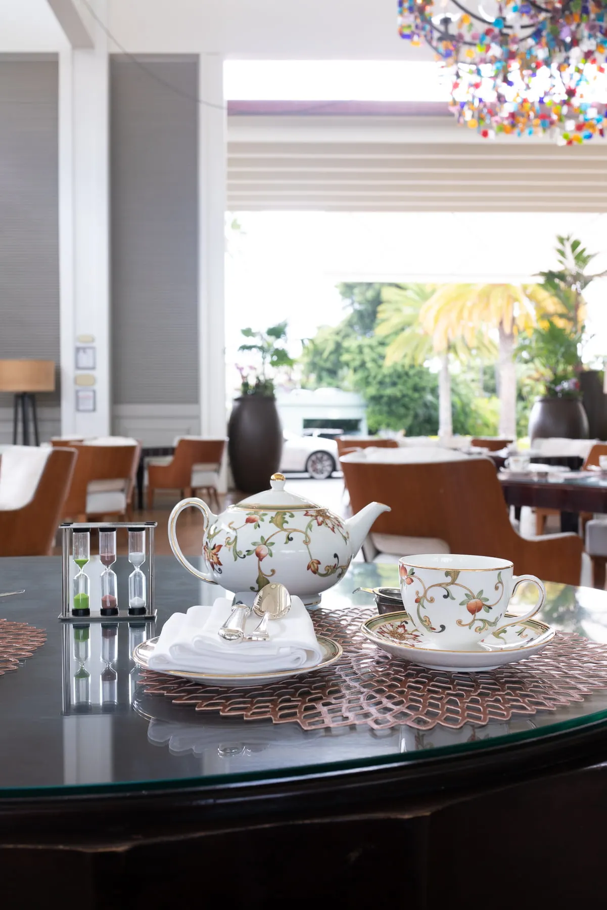 A cup of tea and teapot and plate at Kahala Hotel’s afternoon tea.