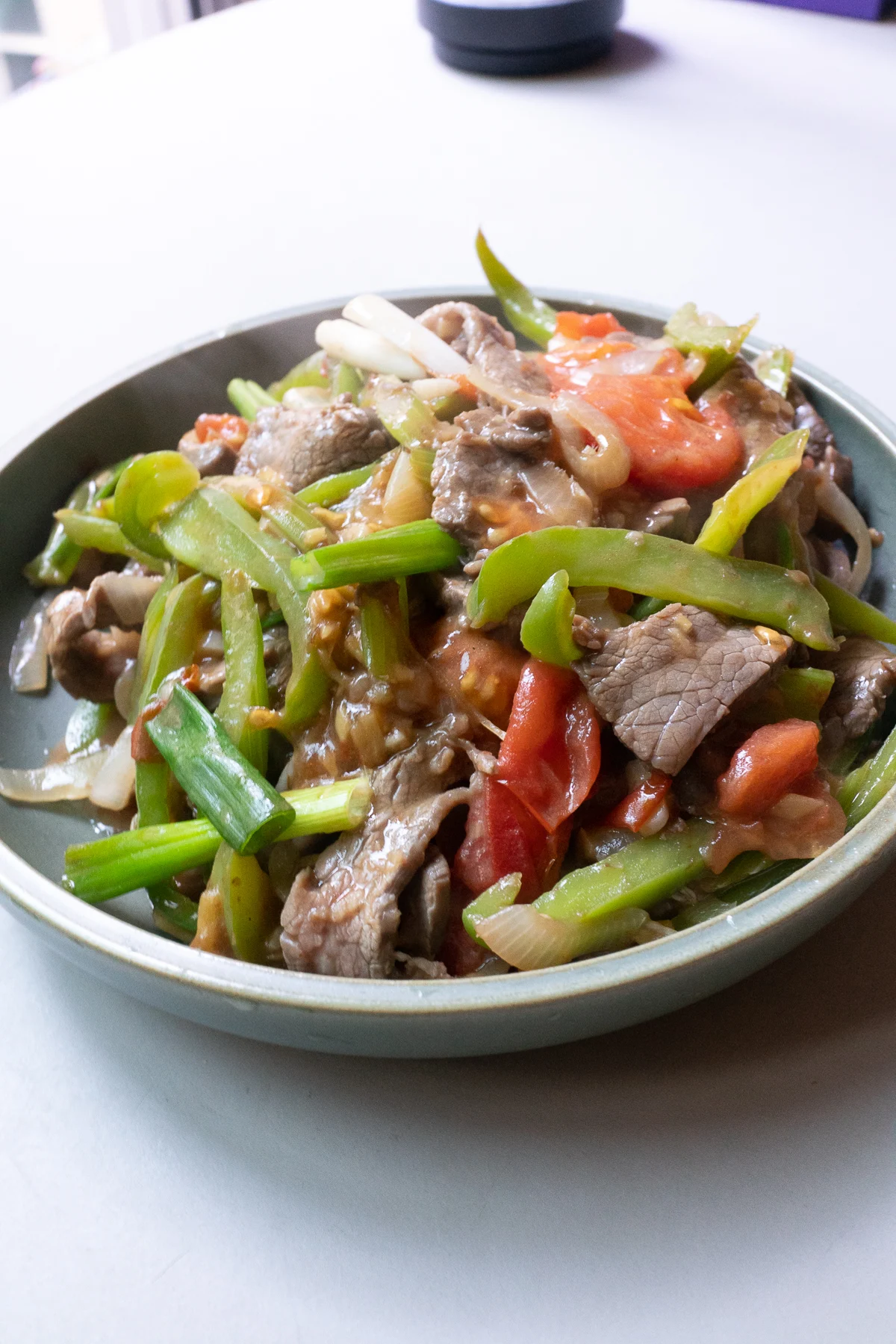 The prepared beef tomato dish, ready to serve with rice.