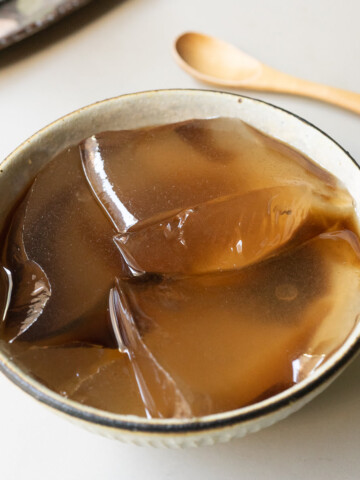 Aiyu jelly in a bowl with brown sugar syrup.