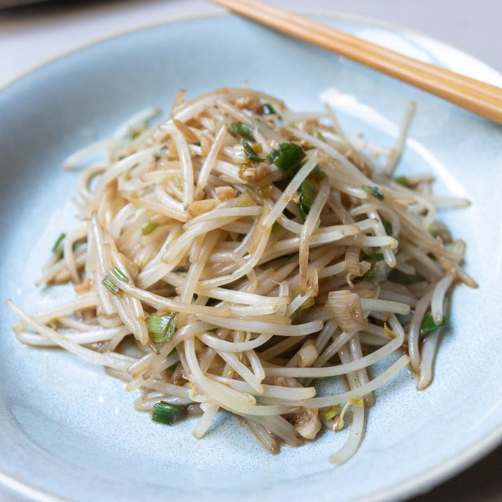 A plate of bean sprouts stir fry, ready to eat.