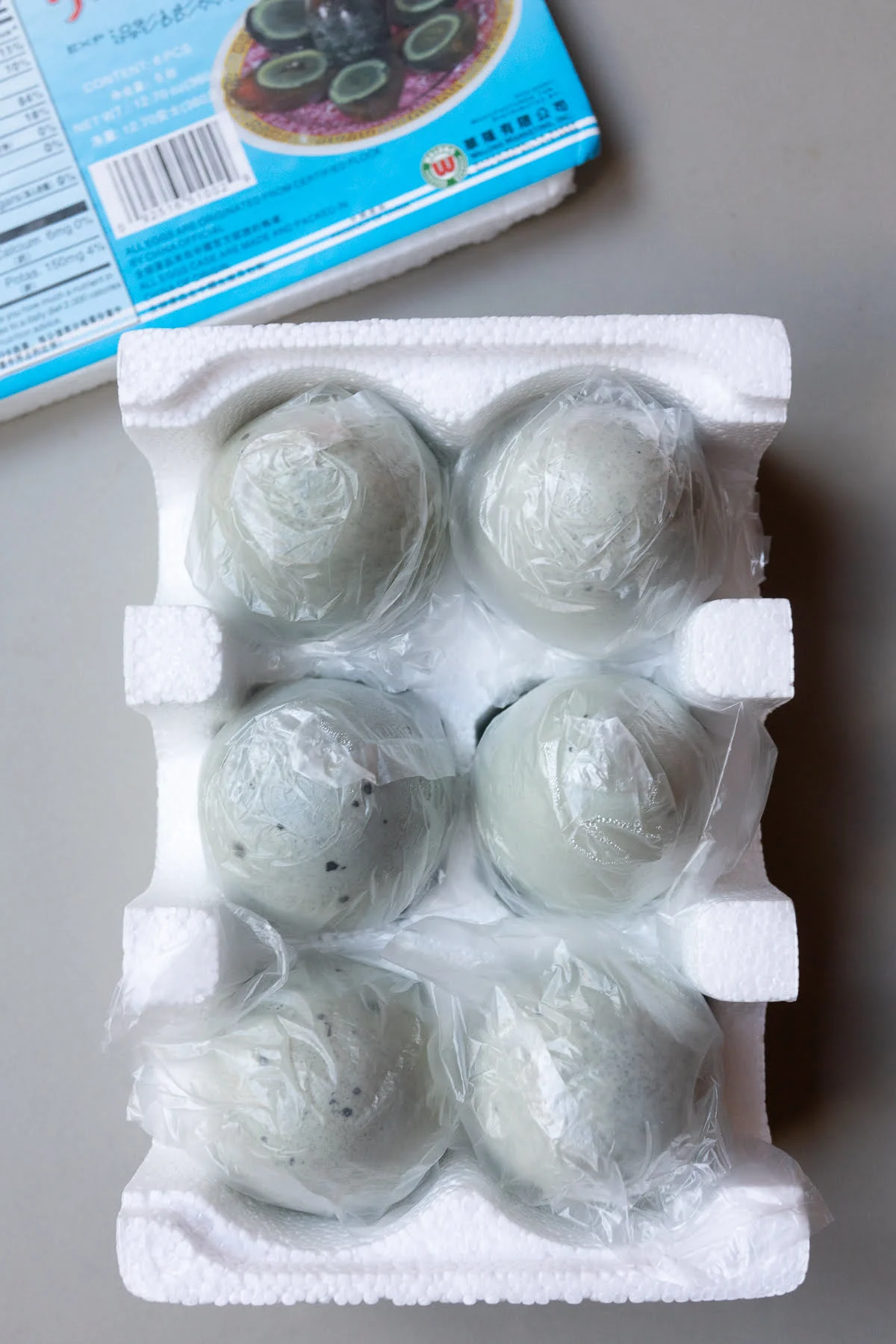 A box of unpeeled century eggs.