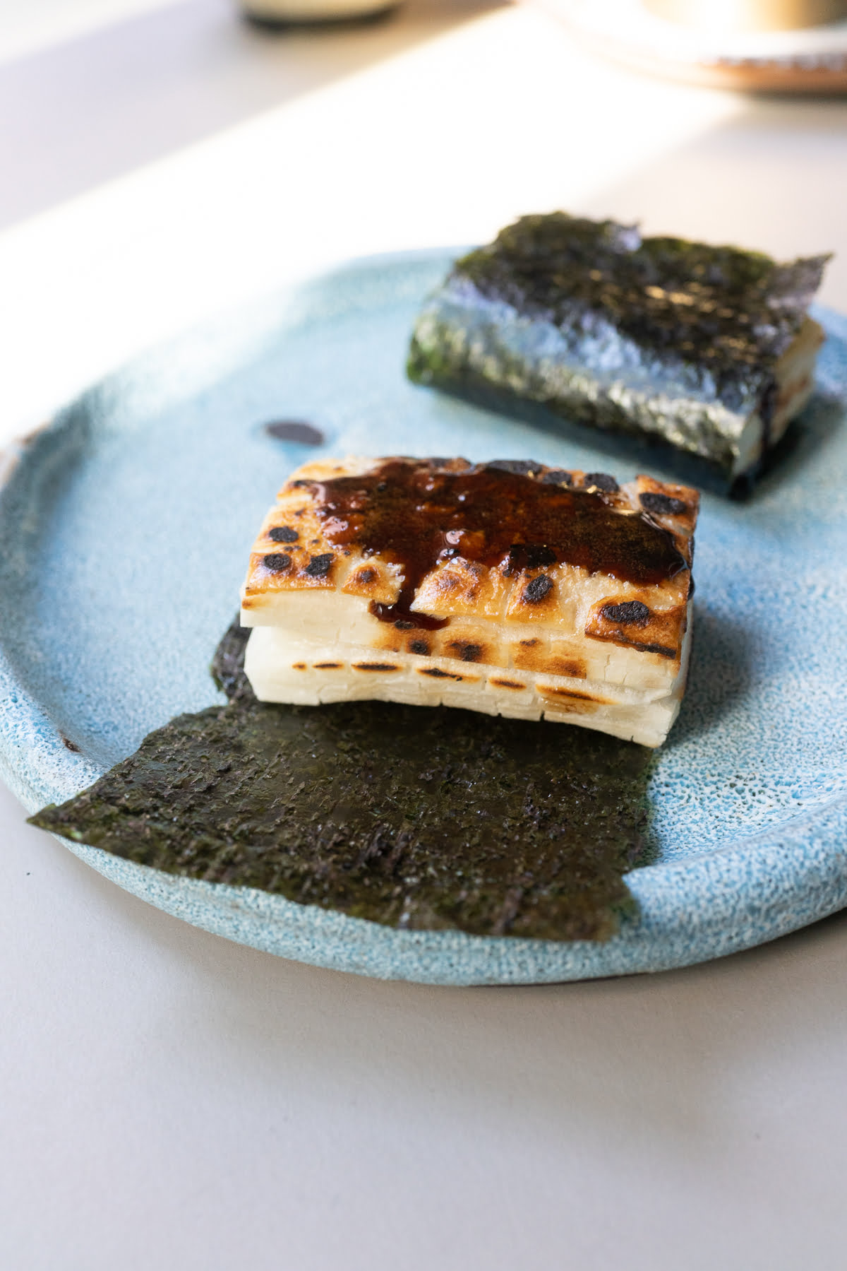 Prepared isobeyaki on a plate, ready to eat.