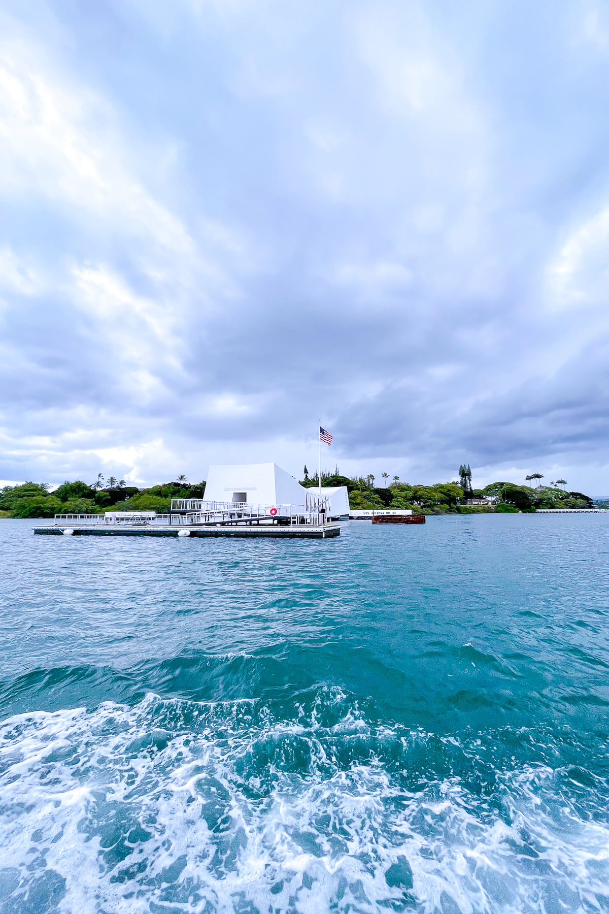 Approaching the USS Arizona Memorial by boat while visiting Pearl Harbor.