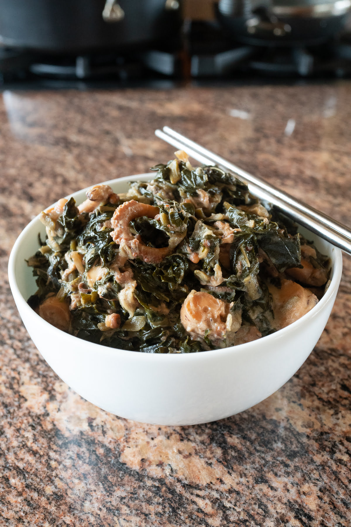 A bowl of squid luau, ready to eat.