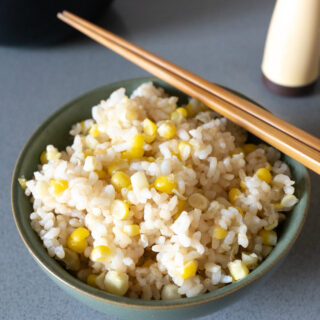 A bowl of corn rice, ready to eat.