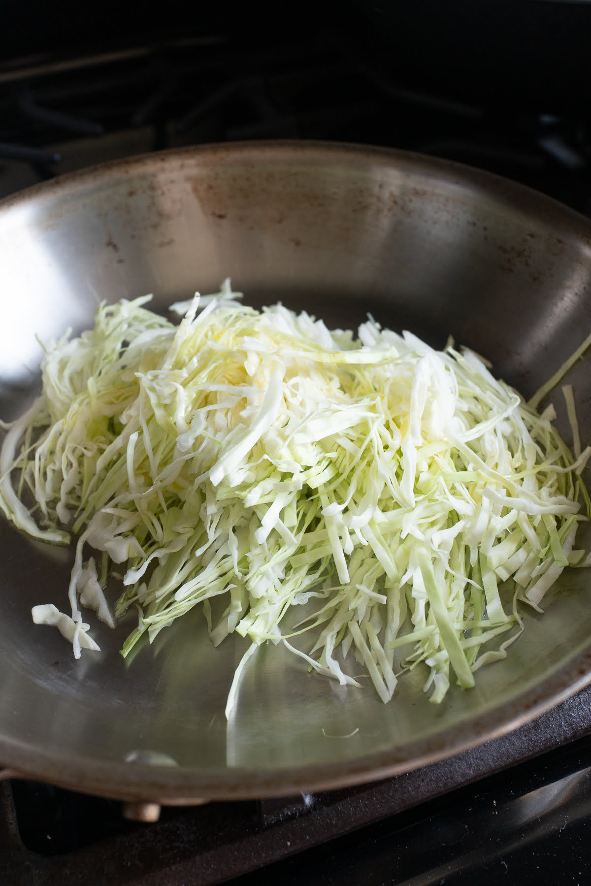 Cooking cabbage in a pan.