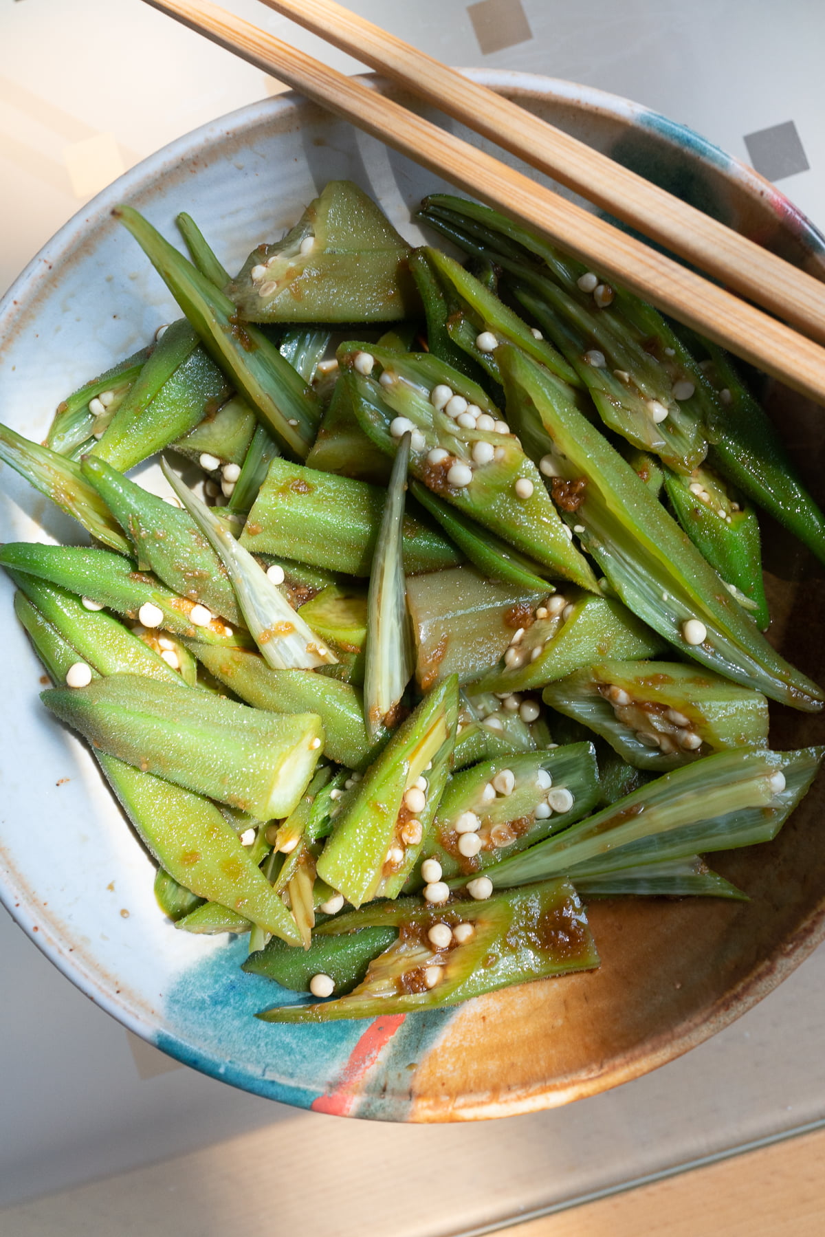 A bowl of okra and ginger soy sauce, ready to eat.