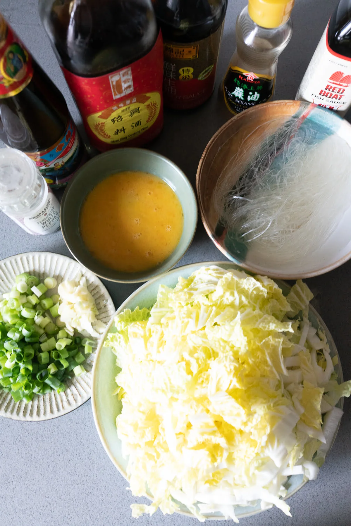 Ingredients for Glass Noodles and Cabbage Stir Fry on a table.