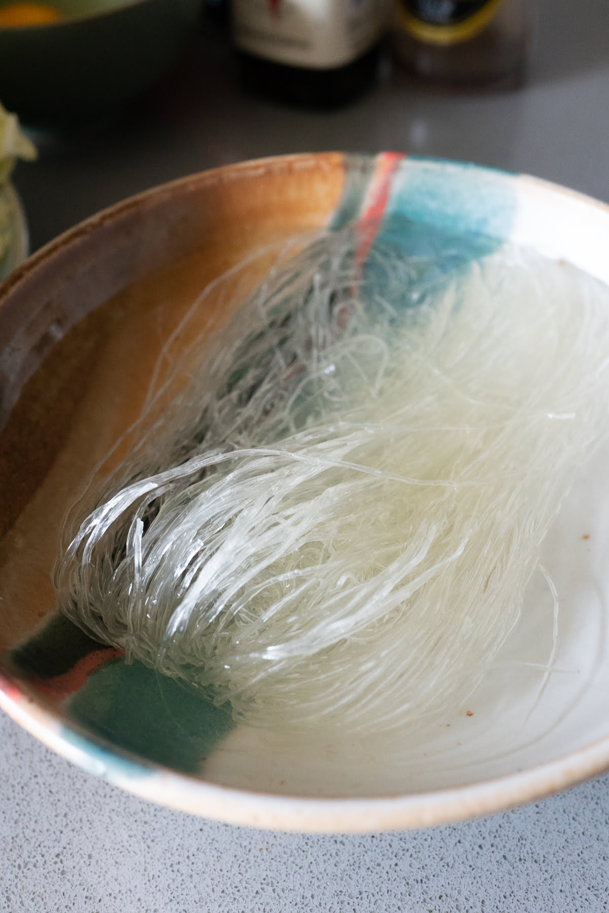 Soaking glass noodles (aka cellophane noodles) in water.