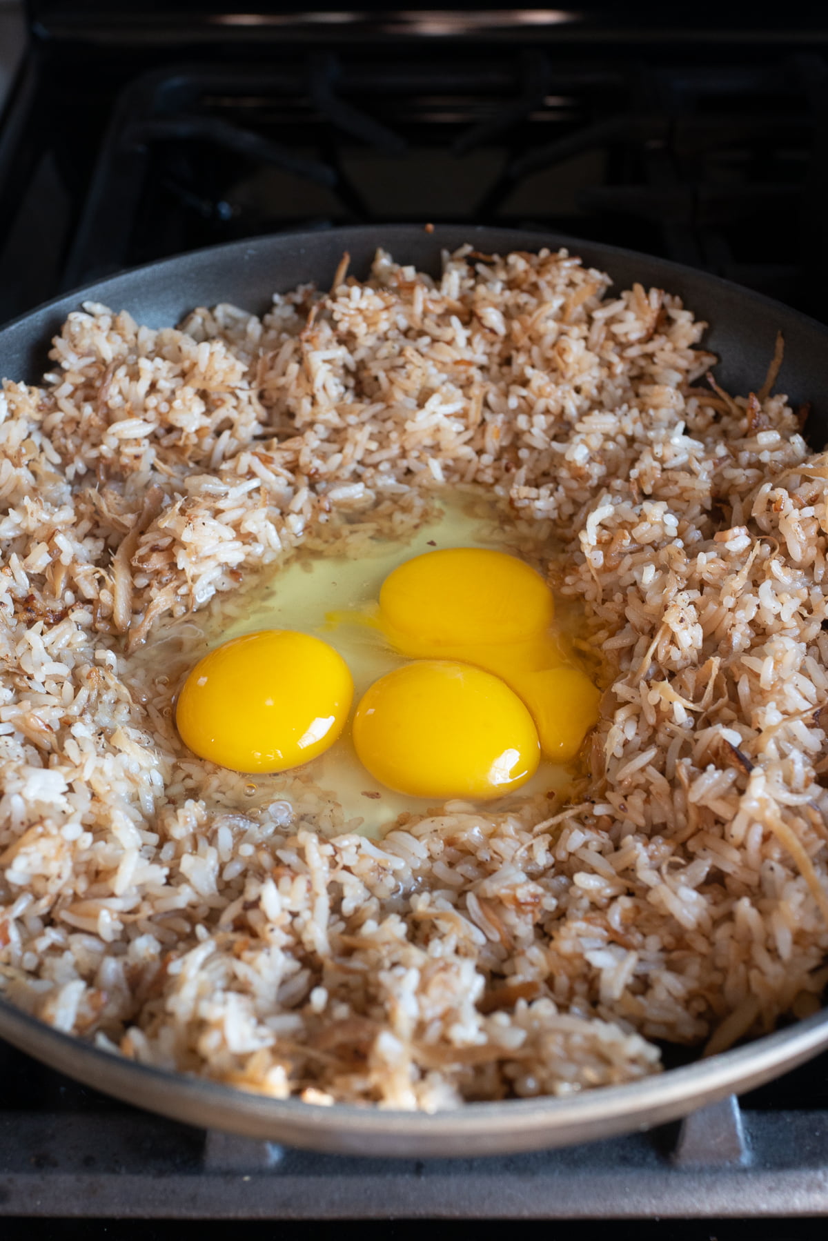 Right after adding eggs to the frying pan with the fried rice.