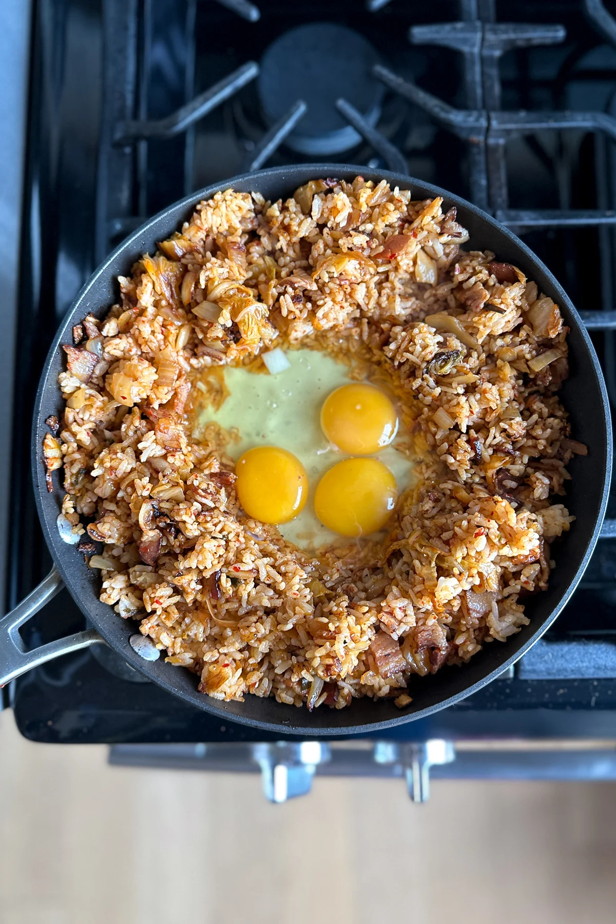 Adding the eggs to the pan, to scramble for kimchi fried rice.