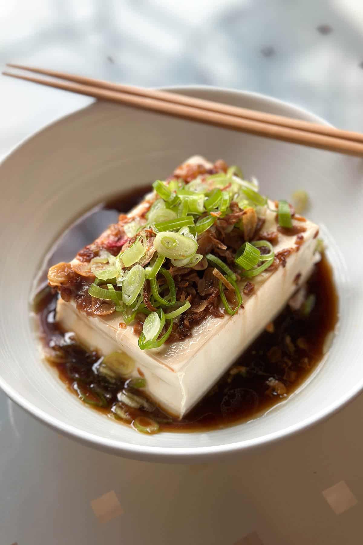 Silken tofu / cold tofu, plated and ready to eat.