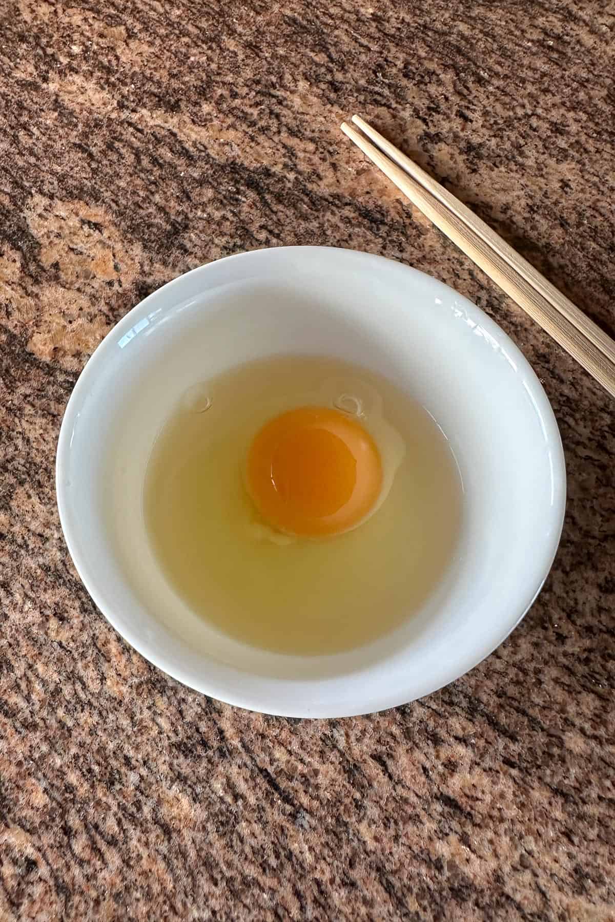 A fresh egg from OK Poultry in Hawaii, just cracked.