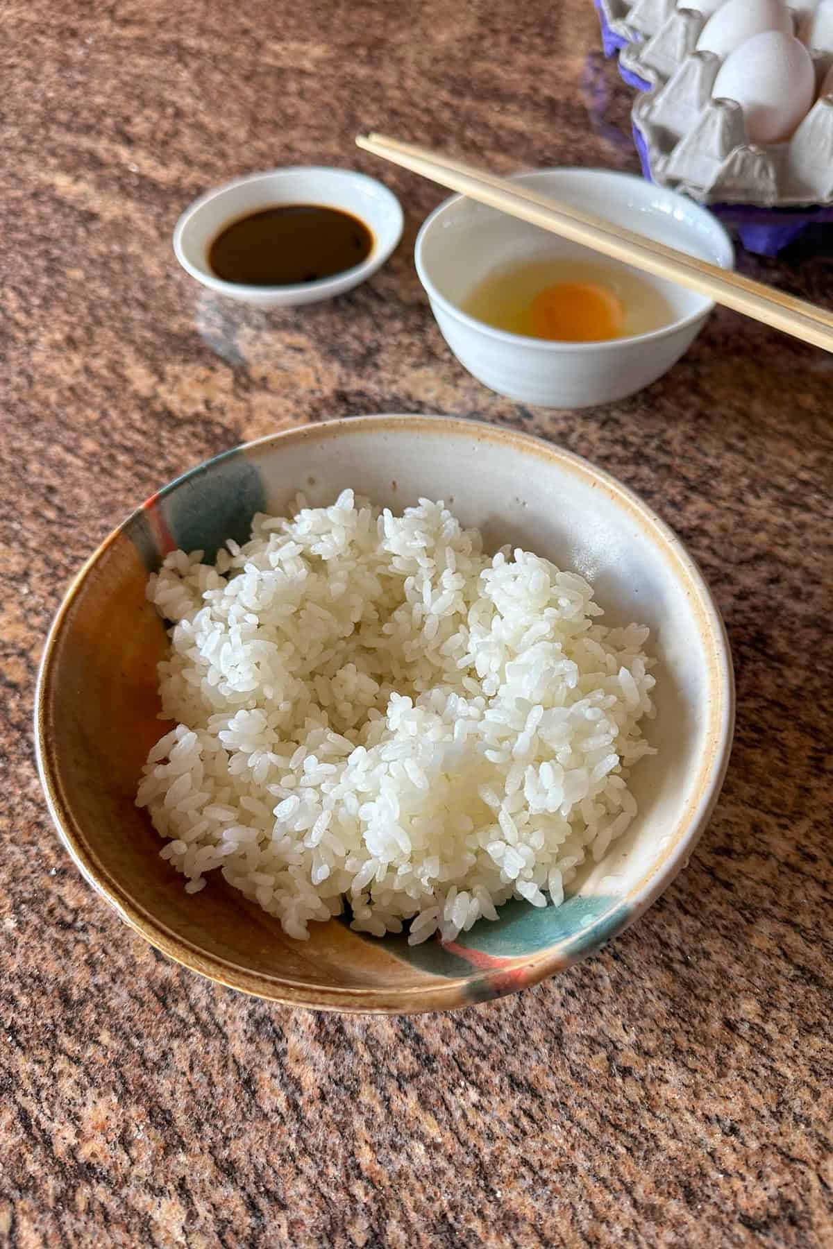 A bowl of rice with an indent in the center for making Tamago Kake Gohan.