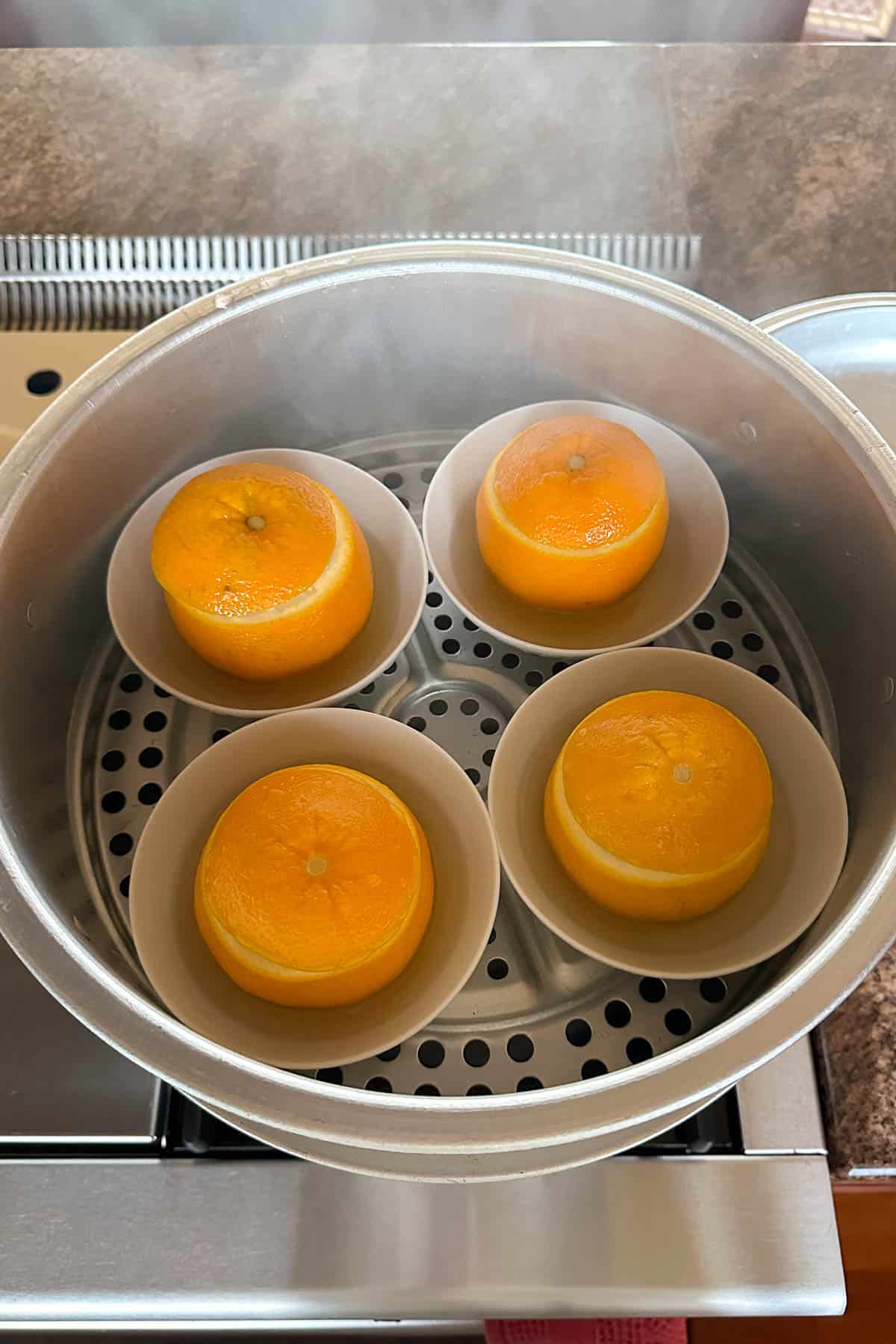 Steaming oranges with salt.