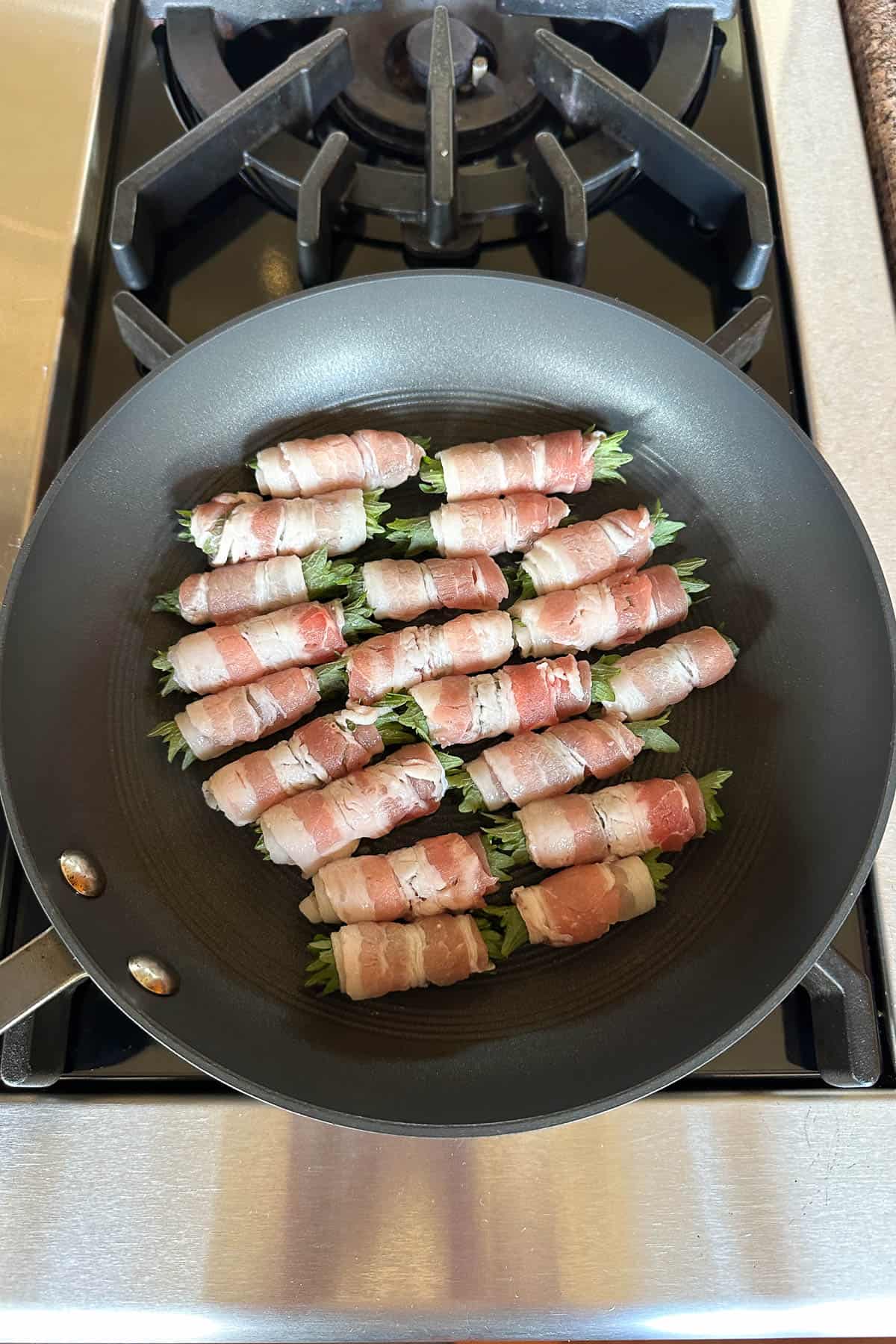 Pan frying the pork belly and shiso rolls.