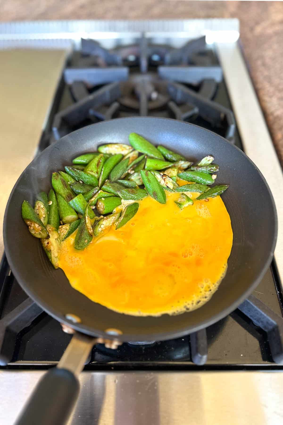 Making okra and eggs.