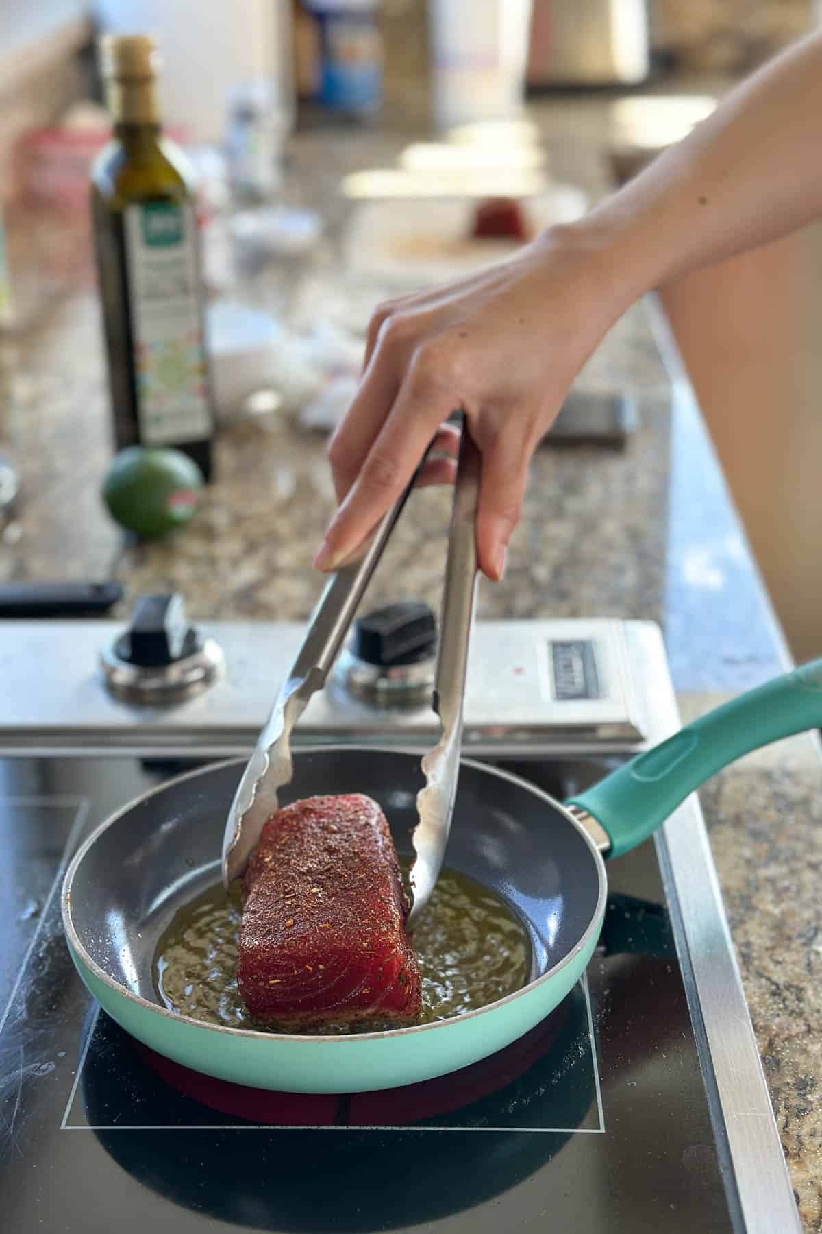 Searing a tuna steak.