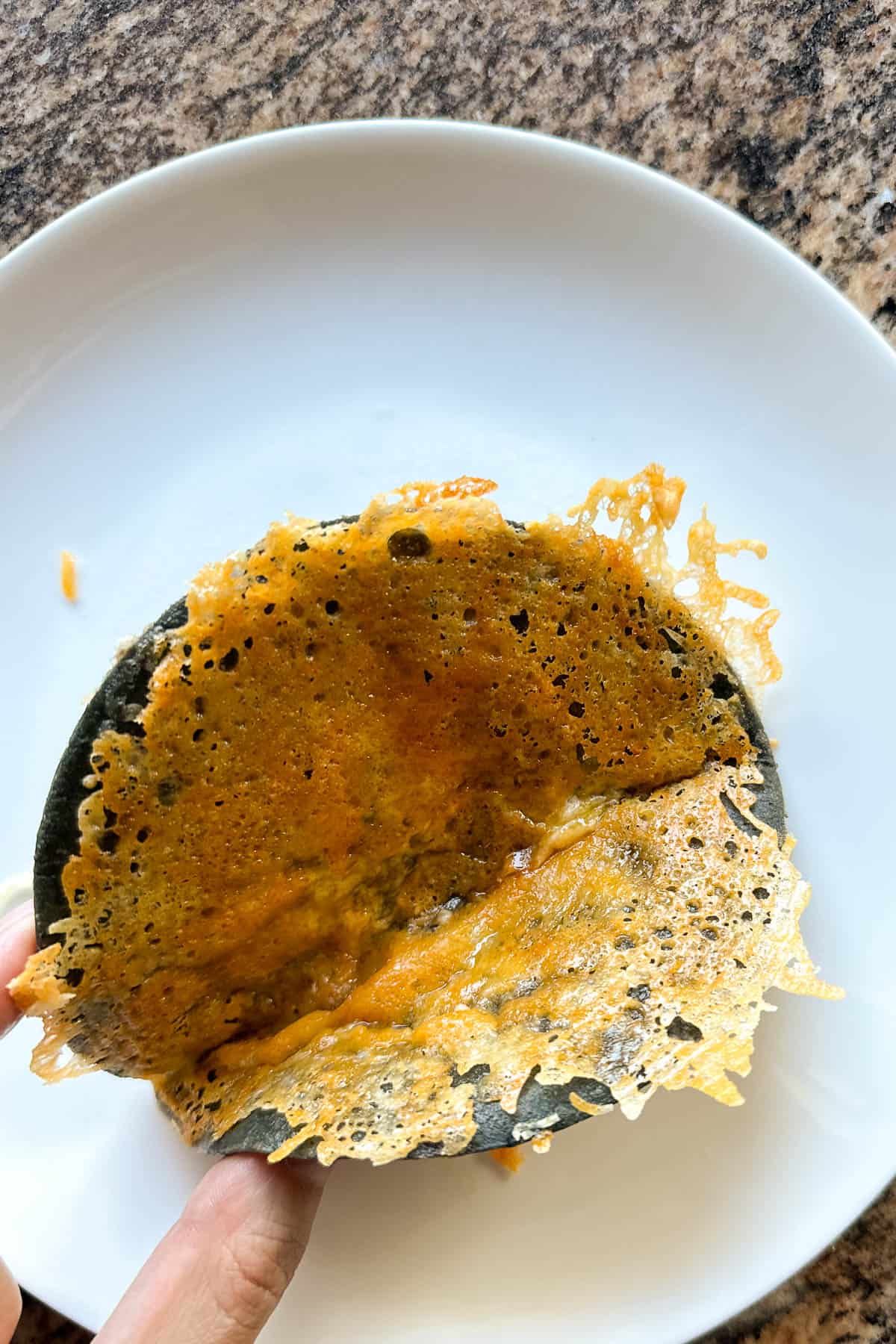 Making crispy cheese tacos.