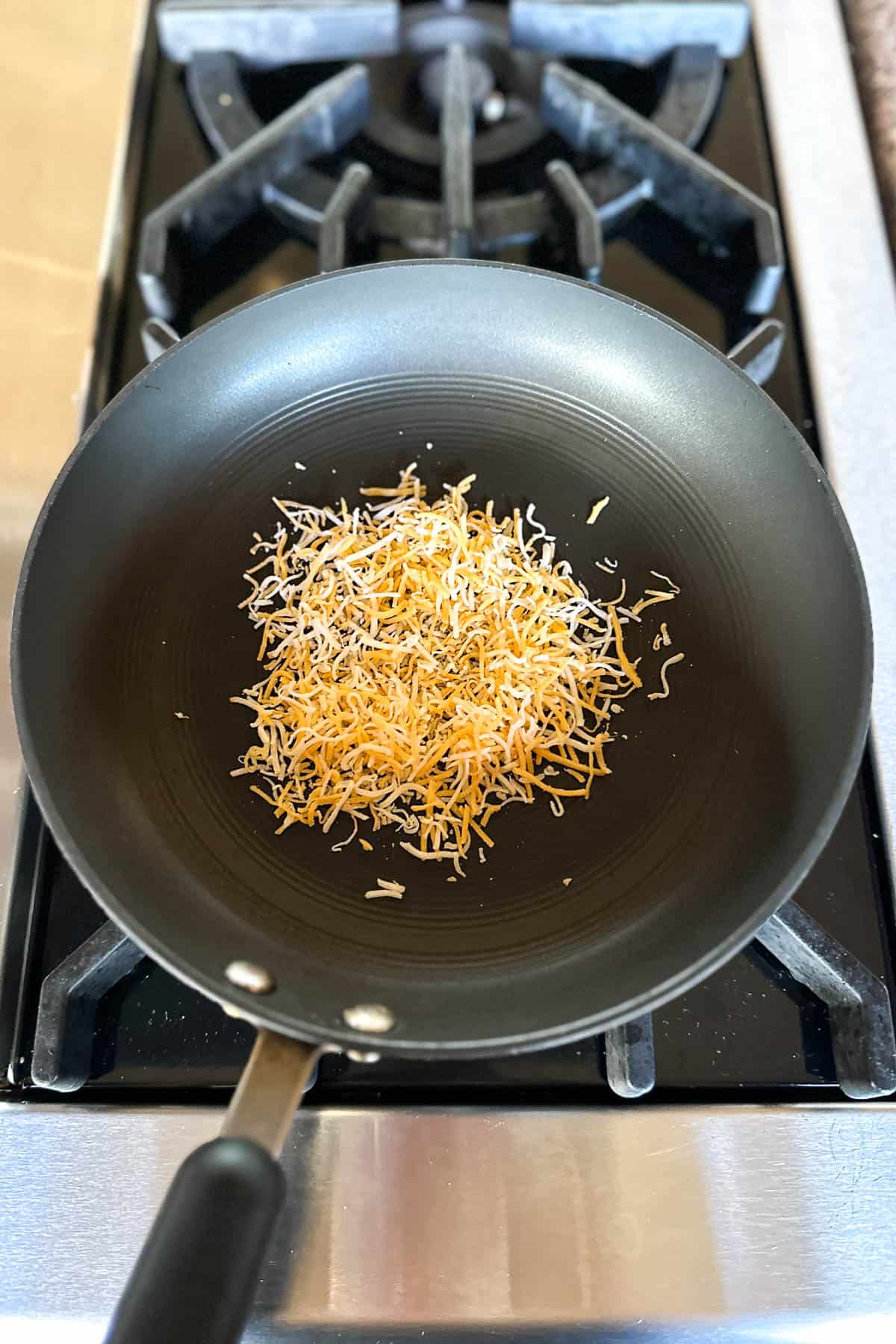 Making crispy cheese tacos.