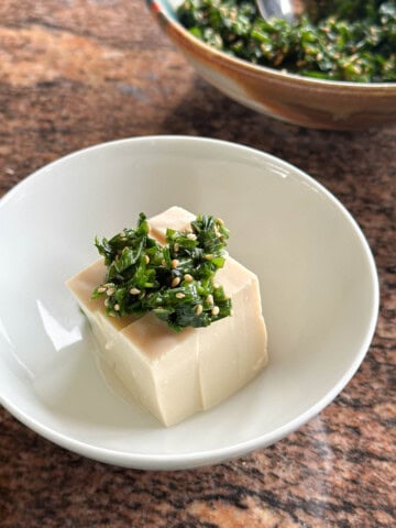 Garlic chive sauce served over soft tofu.