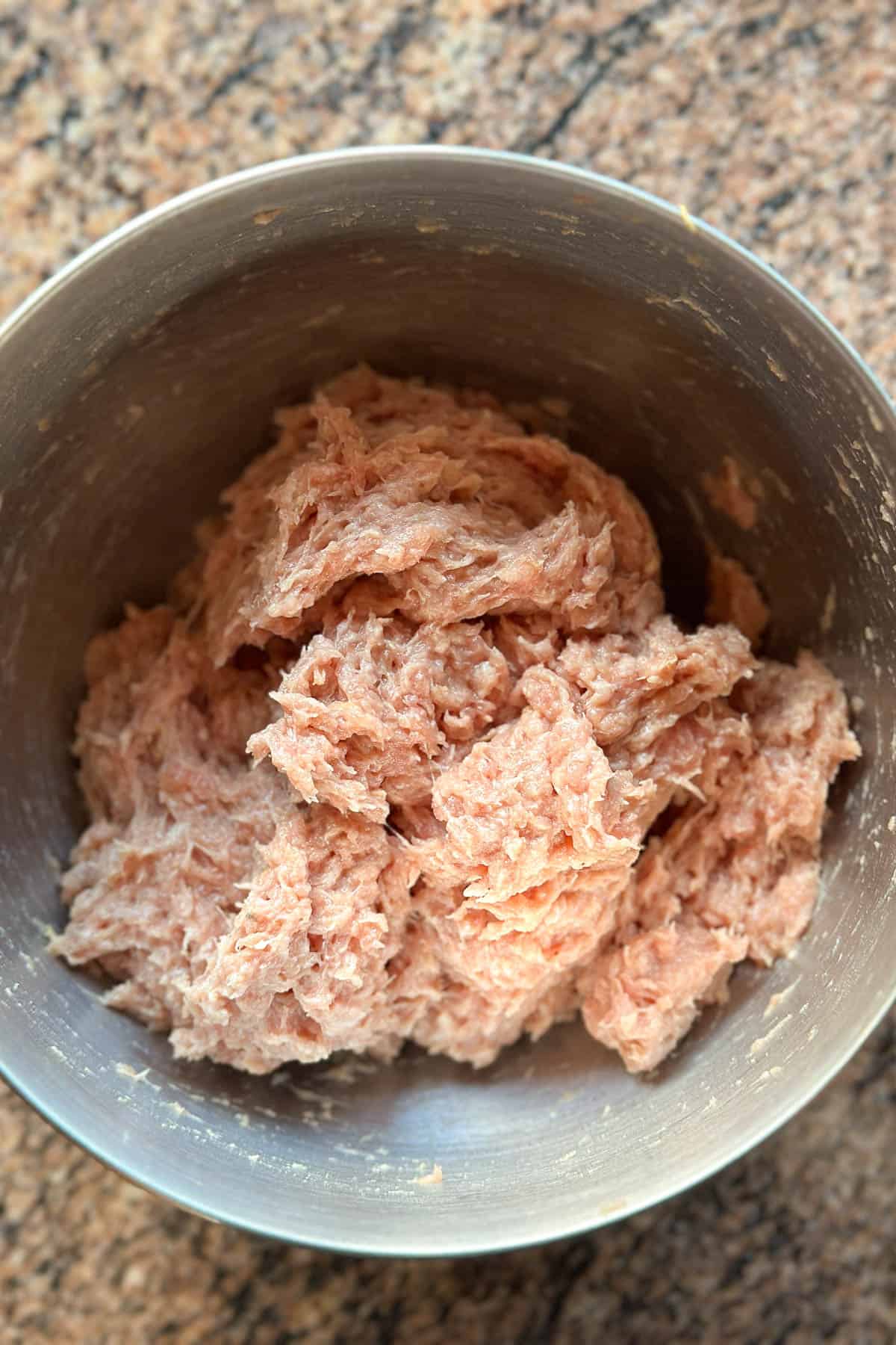 Mixing the pork filling for mini wontons.