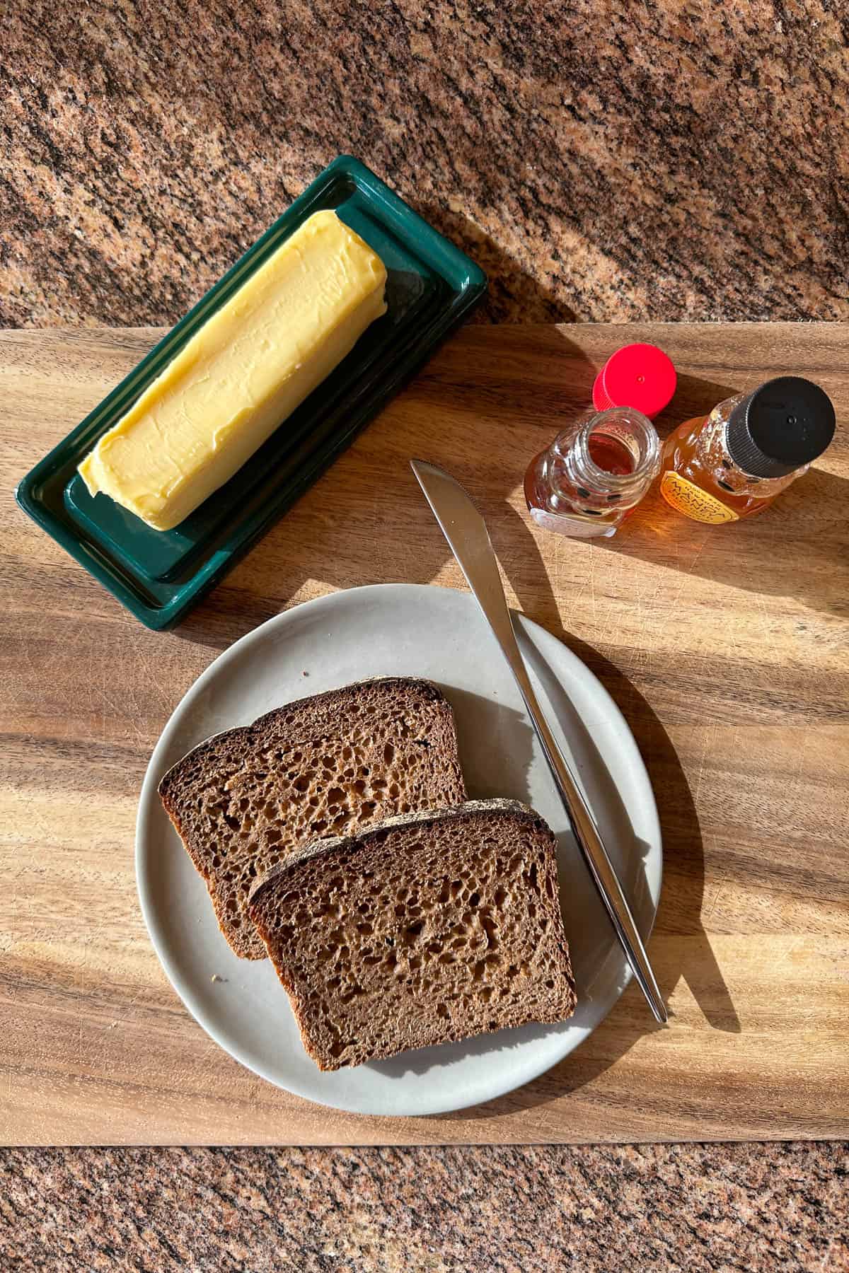 Making honey butter toast on rye bread.