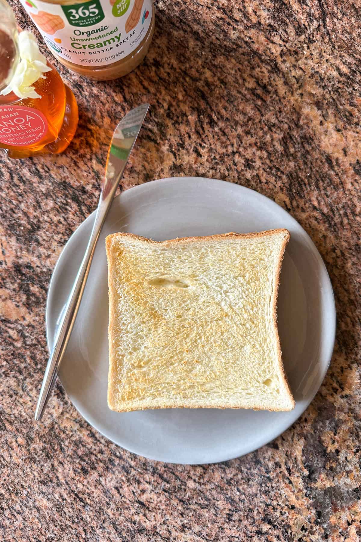 Toasting bread for Peanut Butter and Honey Toast.